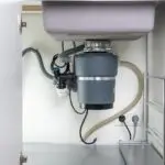 Garbage Disposal under the modern sink, waste chopper concept