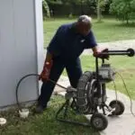 Adams Plumbing & Drain Company performing drain cleaning in Alpine Hills, Mobile, AL