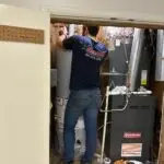 Adams Plumbing & Drain Company installing water heater in Bellewood, Mobile, AL