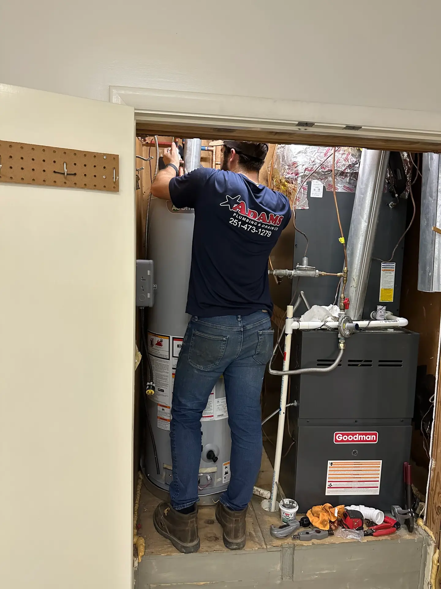 Adams Plumbing & Drain Company installing water heater in Bellewood, Mobile, AL