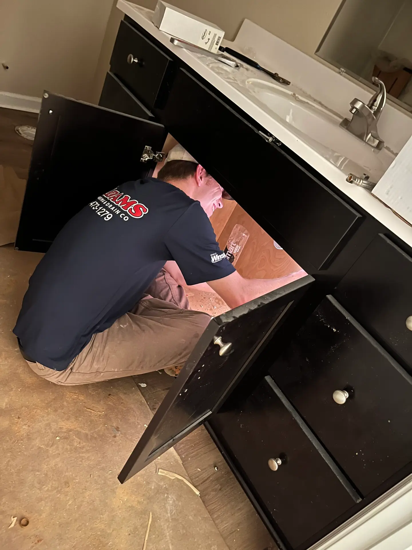 Adams Plumbing & Drain Company emergency plumber fixing a burst pipe in Brookwood, AL