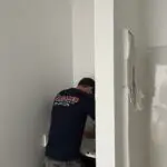 Adams Plumbing & Drain Company repairing a leaky faucet in Overlook, AL