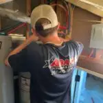 Adams Plumbing & Drain Company replacing a broken water heater in a Westhill, AL home